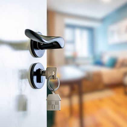 A key in the front door of a new home